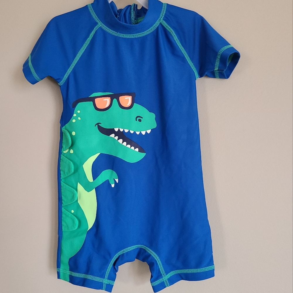 Blue dinosaur rash guard one piece swimsuit